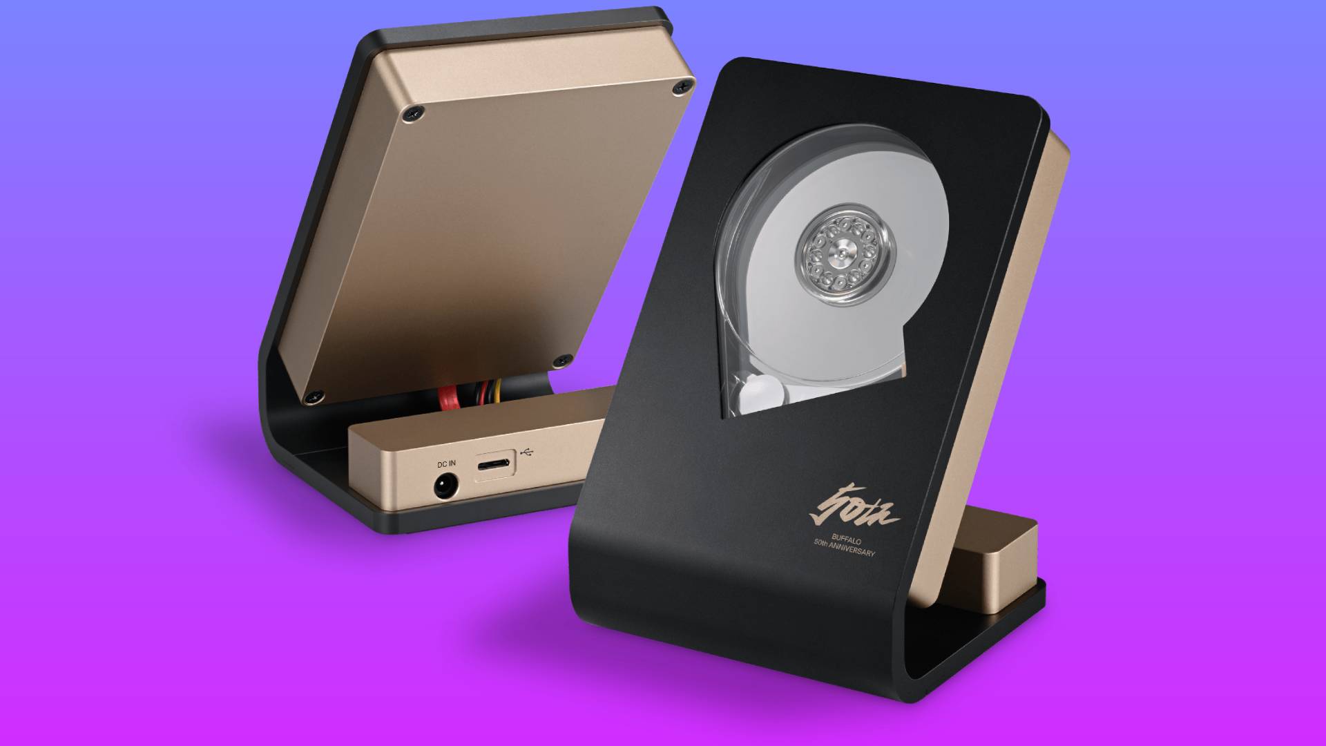 Two angles of Buffalo&#039;s HD-SKL, a HDD mounted in a picture frame-style. The surface has a transparent window, allowing users to see the HDD function while in use. Two of this HDD float in a blue-pink gradient void.
