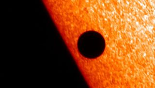 Japan's Hinode spacecraft captured this image of Mercury passing in front of the sun on Nov. 8, 2006, using the spacecraft's Solar Optical Telescope instrument.