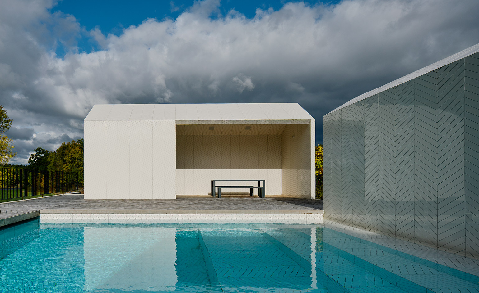 The structure is set in the grouns of a late-19th century house