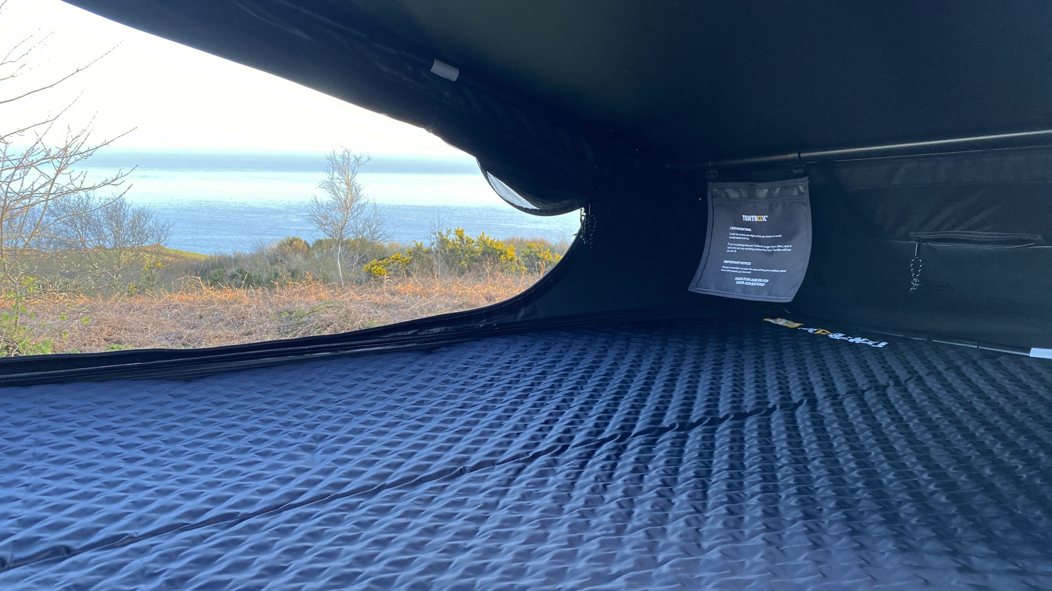Showing the bespoke self-inflating camping mat inside the TentBox Go