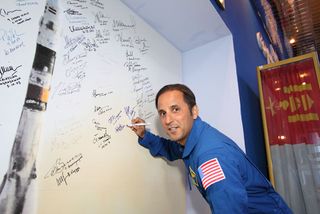 Joe Acaba signs wall at Baikonur for Expedition 31.