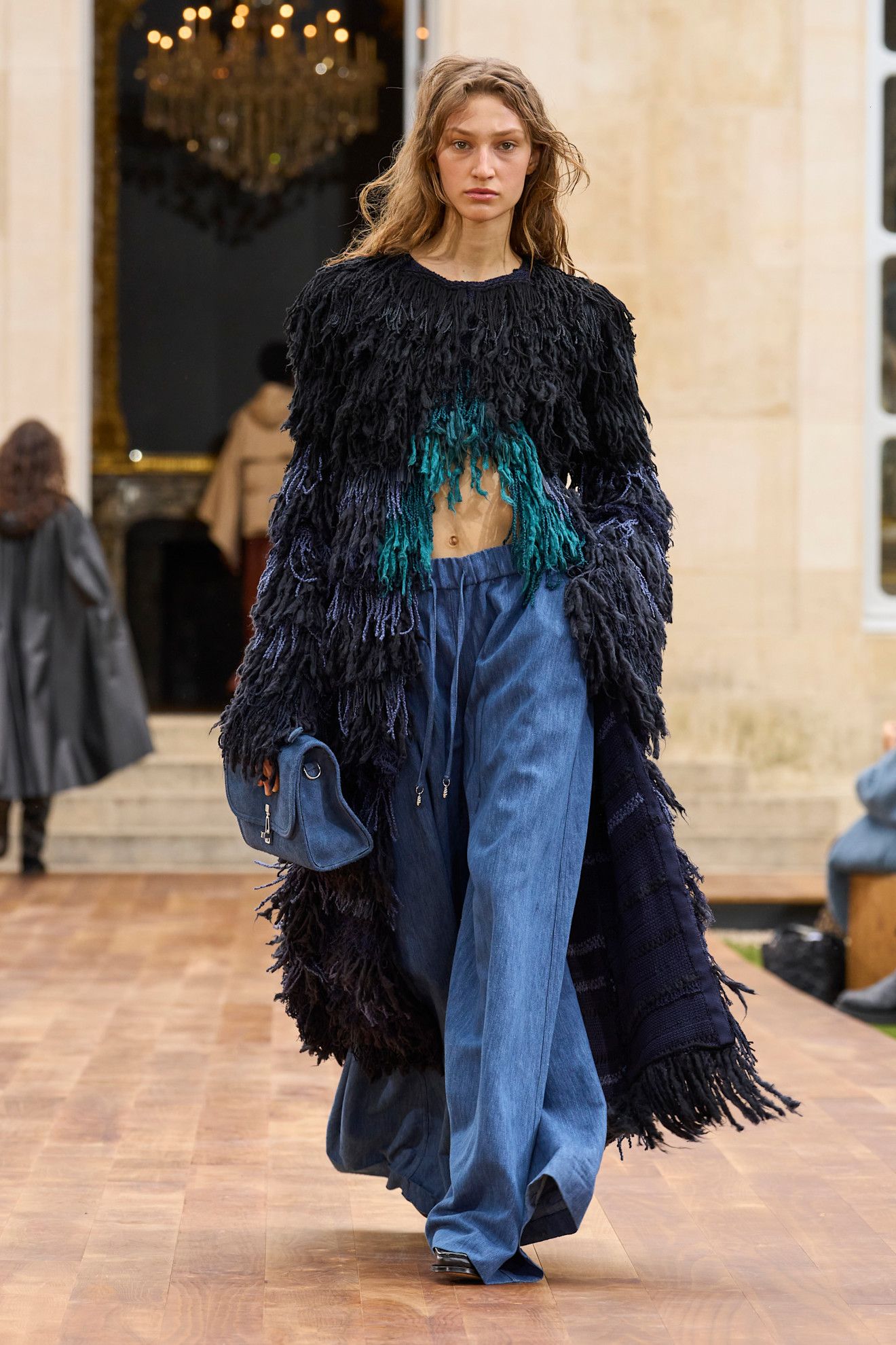 Model wears drawstring jeans on the Gabriella Hearst spring/summer 2025 runway.