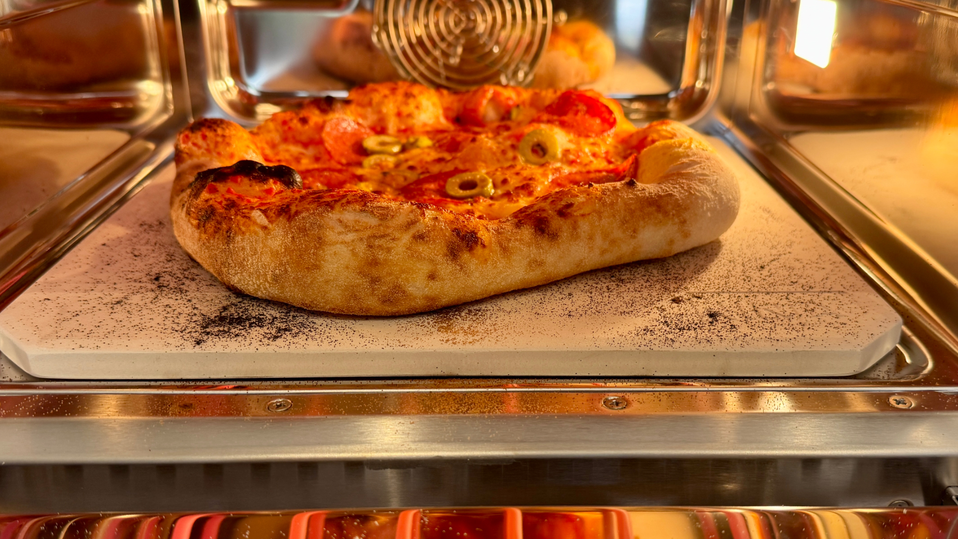 Ninja Artisan Electric Pizza Oven & Air Fryer pizza on stone