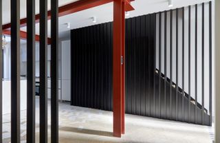 The red column and black joinery of Project Hereward, a small project for architects Studio VA