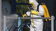 Ebola health worker wearing a full biohazard suit 