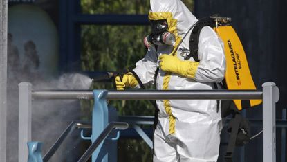 Ebola health worker wearing a full biohazard suit 