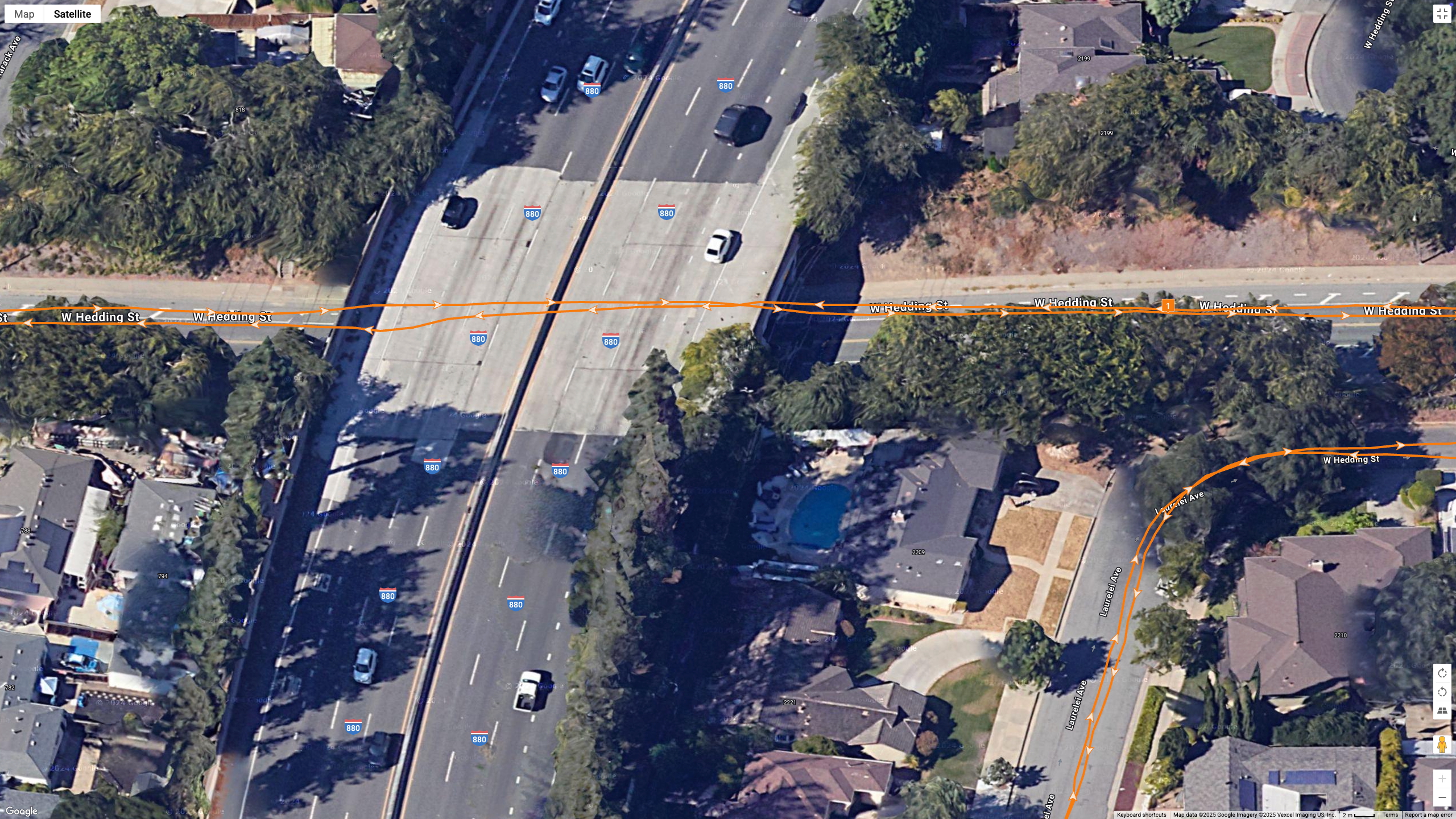 Google Maps satellite data showing how the Garmin Forerunner 970 (orange line) tracks my position during a race in downtown San Jose under an underpass and near foliage.