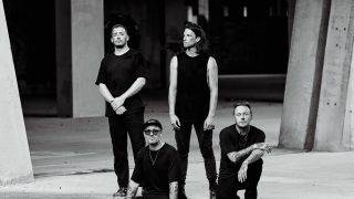 Architects in black and white, posing in a car park