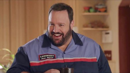 Kevin James in a work shirt and with beared, starring in Grown Ups.