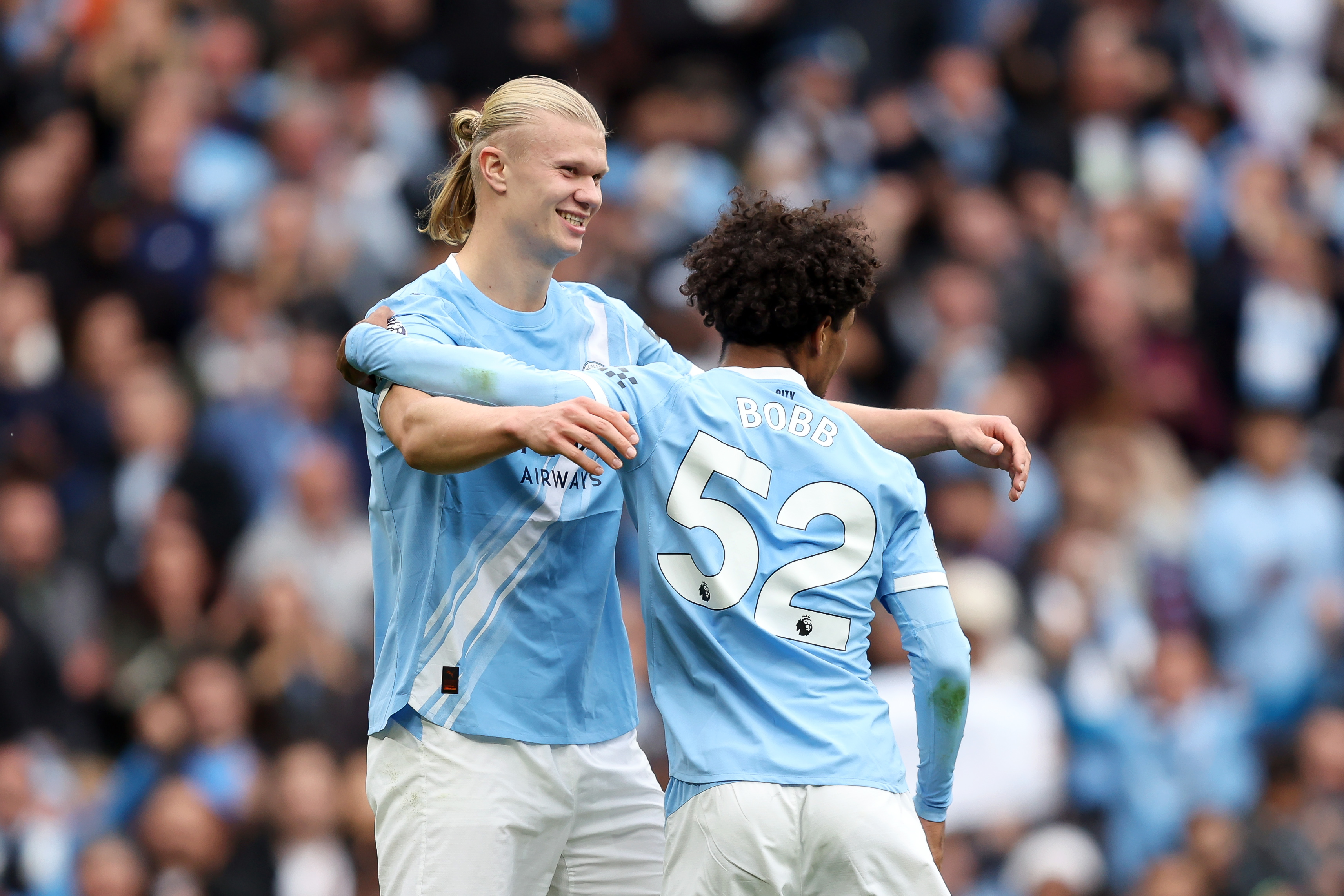 MANCHESTER, ENGLAND - SEPTEMBER 27: Erling Haaland of Manchester City celebrates scoring his team&amp;amp;apos;s fifth goal with teammate Oscar Bobb during the Premier League match between Manchester City and Burnley at Etihad Stadium on September 27, 2025 in Manchester, England. (Photo by Matt McNulty/Getty Images)