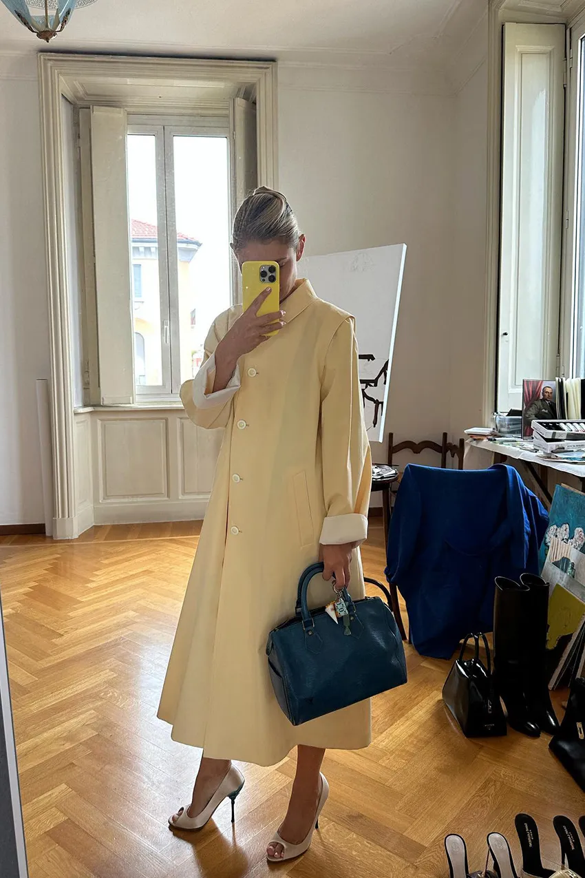 An image of carrying one of the most popular designer handbags.