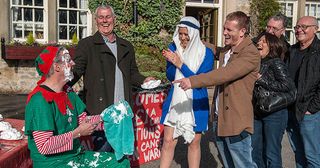 David Metcalfe tells Frank Clayton and Tracy Metcalfehe wants to fundraise for his cancer ward, not do a skydive. Frank wants to help and dresses as an elf with a sign inviting people to throw foam pies at him for charity. But unseen by Frank, Bobby gets off the bus in Emmerdale.