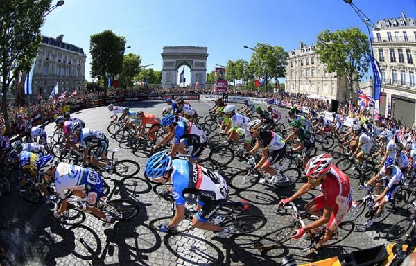 The Tour de France peloton under glorious summer sunshine on the Champs-&Eacute;lys&eacute;es