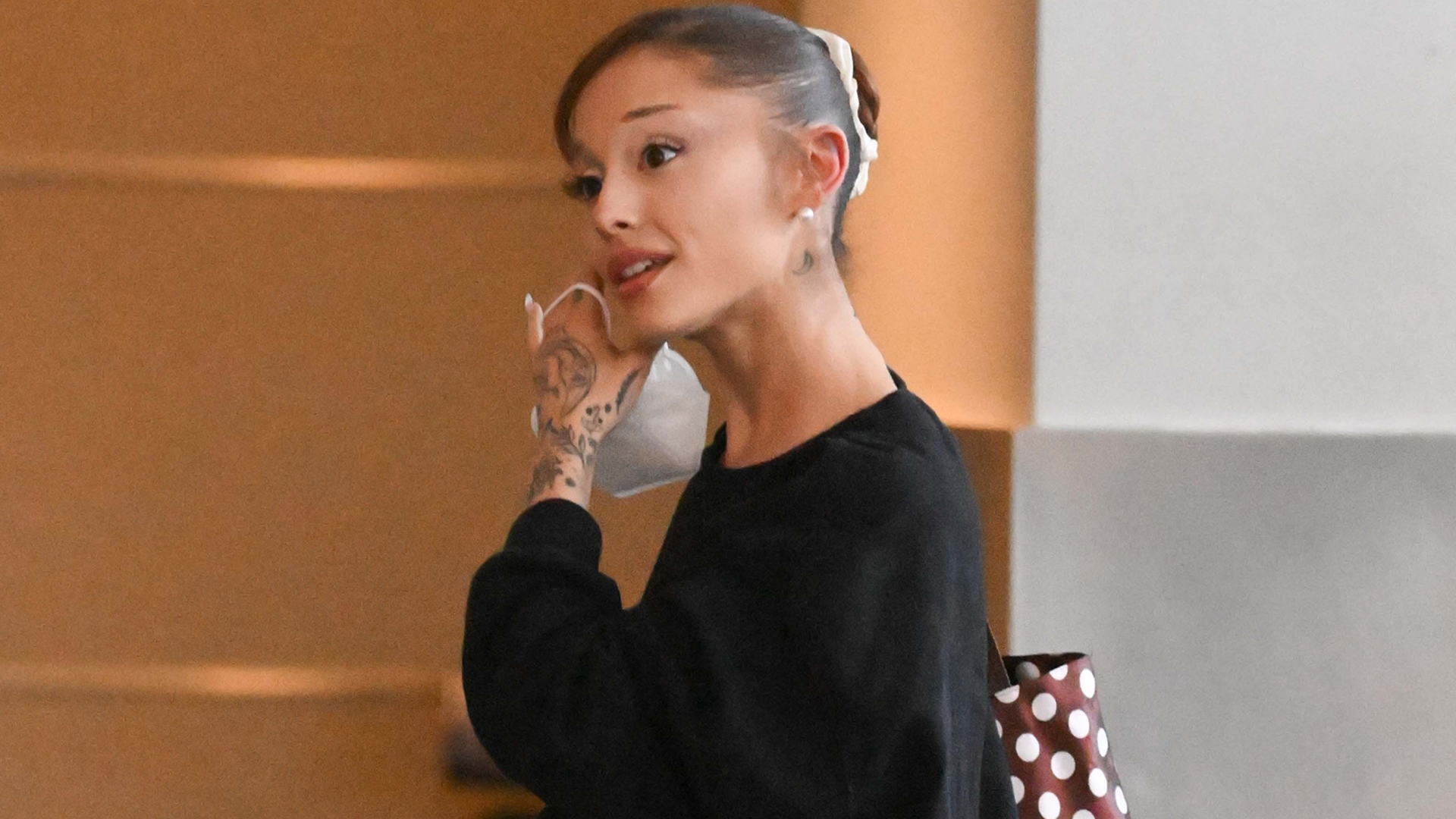 Ariana Grande styled a polka-dot bag and straight-leg jeans with heeled ballet flats