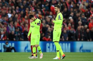 Lionel Messi (left) and his team endured a night to forget at Anfield (PA)