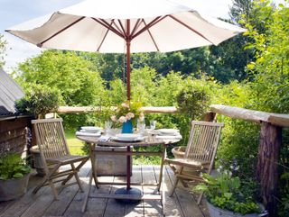 alfresco dining area with florals and linens