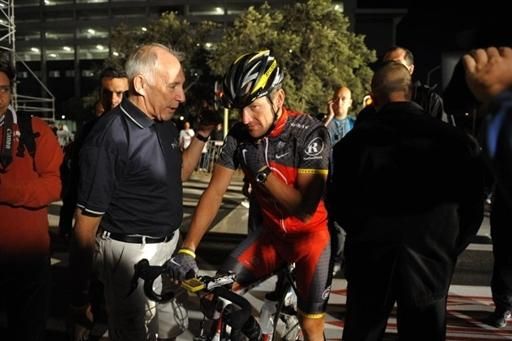 Cycling commentator Phil Liggett interviews Armstrong at the start.