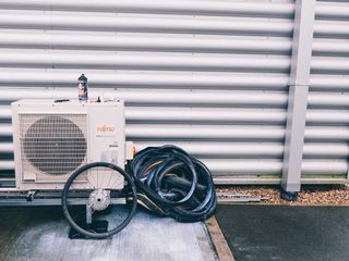 A stack of tubeless tyres and a wheel on the floor along with tubelss sealant