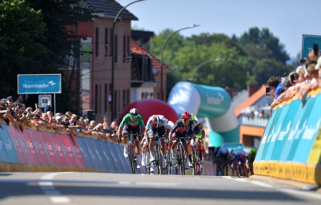BILZEN BELGIUM SEPTEMBER 03 Caleb Ewan of Australia and Team Lotto Soudal sprints to win ahead of Sonny Colbrelli of Italy and Team Bahrain Victorious and Peter Sagan of Slovakia and Team Bora Hansgrohe during the 17th Benelux Tour 2021 Stage 5 a 188km stage from Riemst to Bilzen BeneluxTour on September 03 2021 in Bilzen Belgium Photo by Luc ClaessenGetty Images