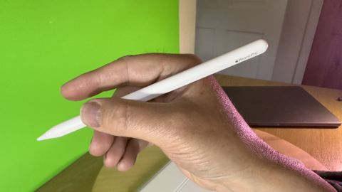 Apple Pencil Pro held in a hand