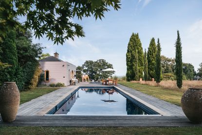 Pool with wrap around decking, seating area and hot tub