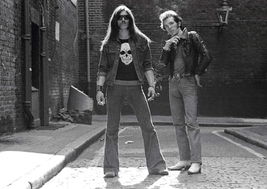 Lemmy and Lucas Fox pose in an alleyway