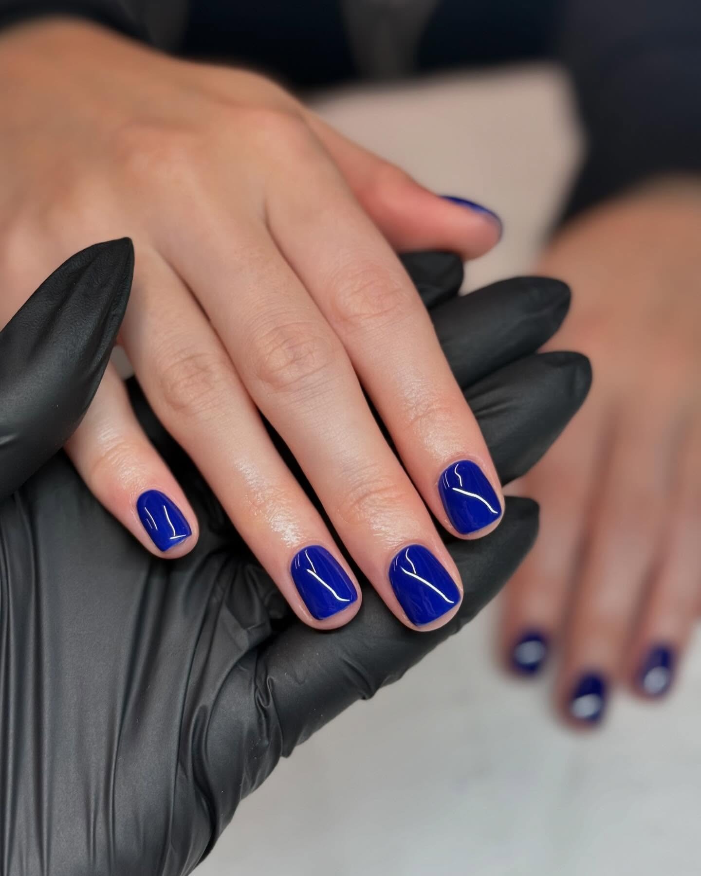 Bright blue nails.