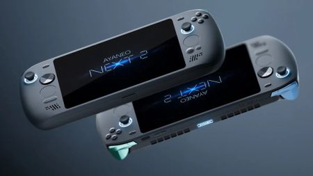 Two Ayaneo Next 2 handhelds with one upright and one behind with triggers facing downwards.