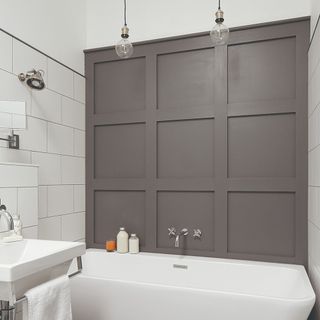 A bathroom with wall panelling