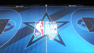 The ATT Slam Dunk logo projected onto the court at Lucas Oil Stadium for NBA All-Star Weekend. 