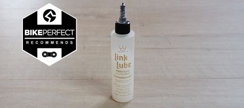 A bottle of Peaty’s Link Lube Premium All Weather lube 