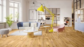 open plan living space with mid brown engineered wood flooring