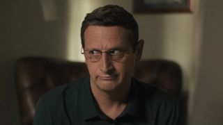 Ron telling Barb about Jeep Tours trip in The Chair Company