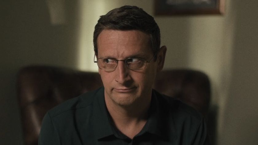 Ron telling Barb about Jeep Tours trip in The Chair Company