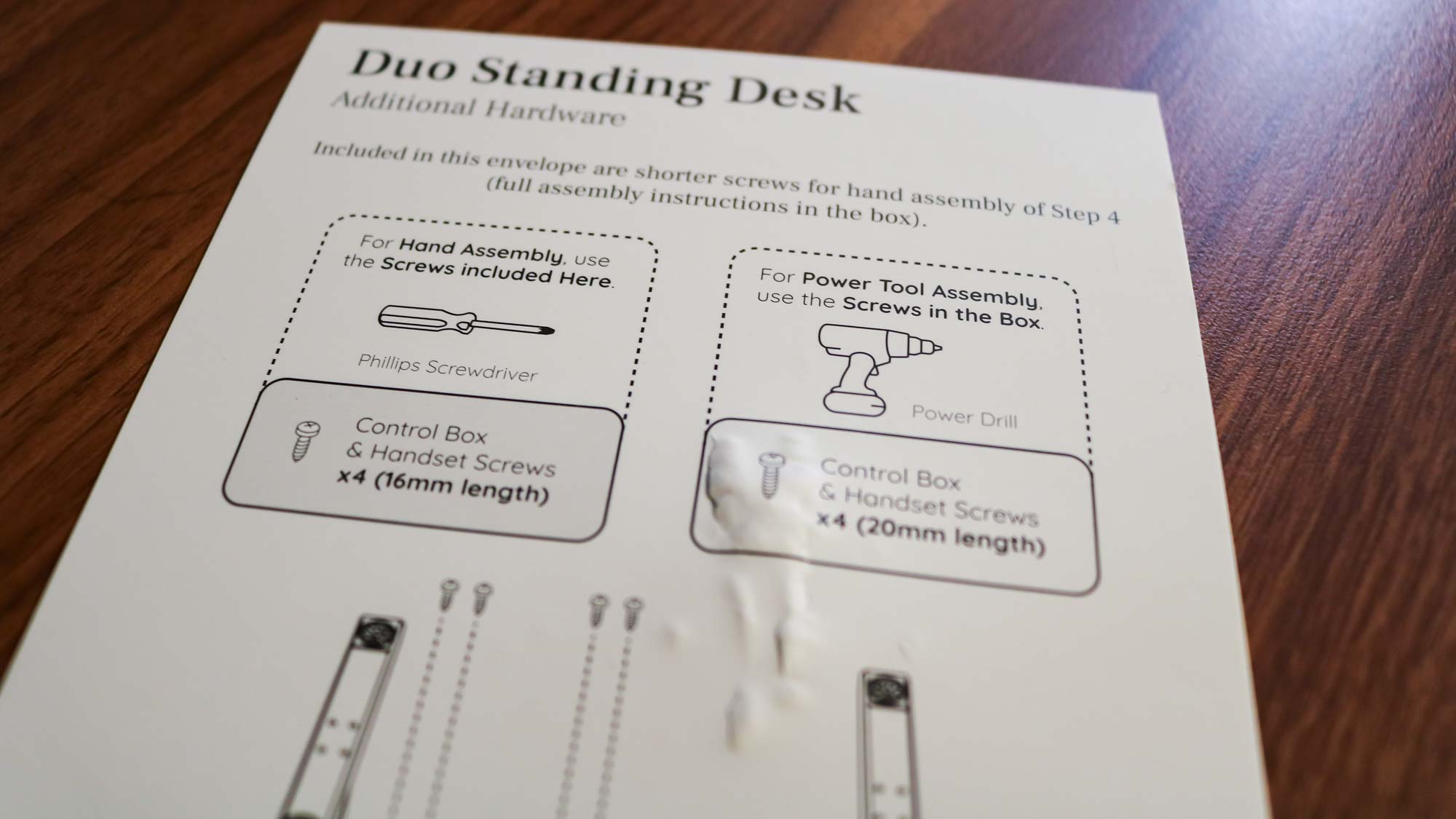 A picture of a flyer explaining how to use the optional screws that ship with the Branch Duo Standing Desk