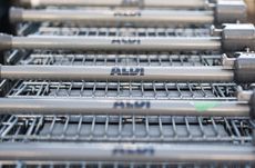BRISTOL, ENGLAND - NOVEMBER 18:Aldi shopping trolleys are stacked outside a branch of the supermarket on November 18, 2015 in Bristol, England. As the crucial Christmas retail period approach