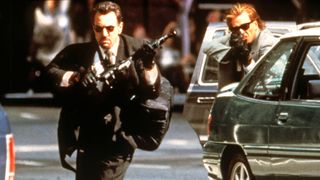 Robert De Niro and Val Kilmer with guns in Heat