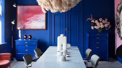 a bright blue and pink dining room
