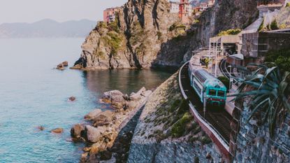 train in coastline in Manarola,Cinque Terre,Italy