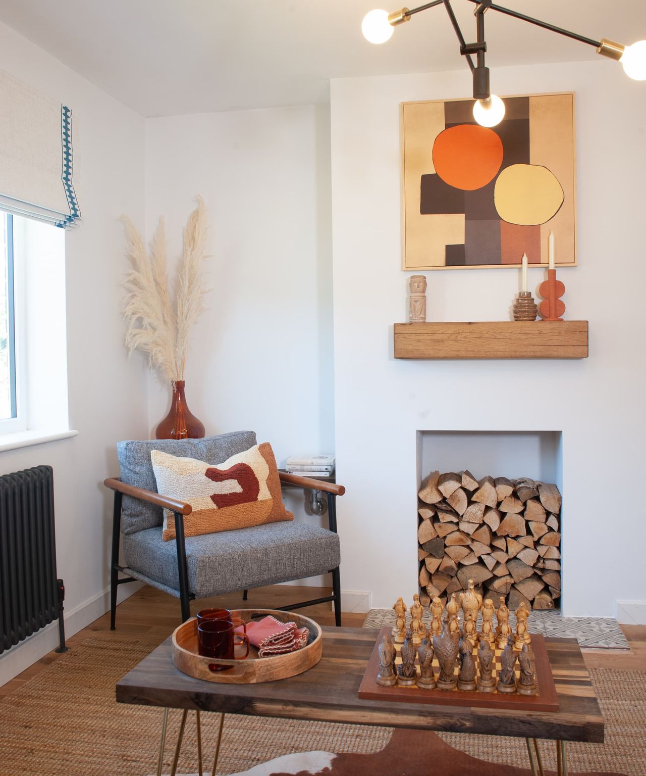The living room has a coffee table and a self built fireplace