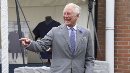 gloucester, england july 09 prince charles, prince of wales laughs during a visit with camilla, duchess of cornwall to the turnbull asser shirt factory on july 9, 2020 in gloucester, united kingdom during the early stages of the coronavirus pandemic the company switched their entire production line to making scrubs for the nhs photo by matthew horwoodgetty images