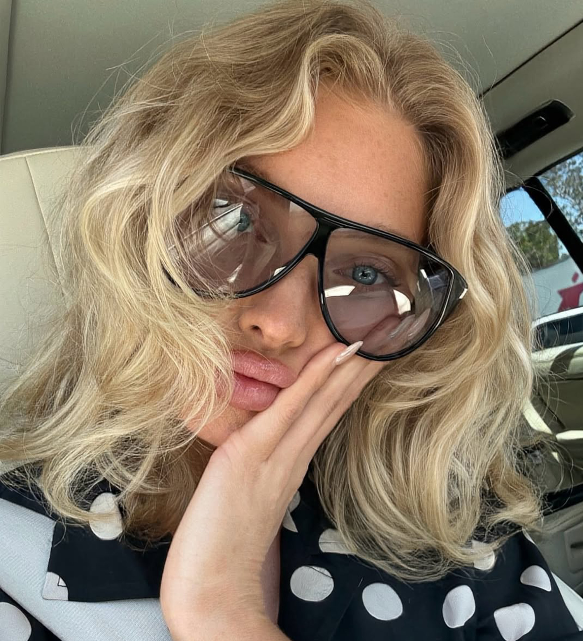 Elsa Hosk wears a baroque bob with windswept curls.