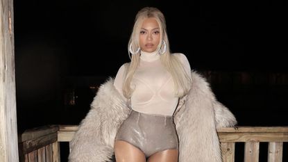 Beyonce in silver sequin hot pants and a nude sheer top