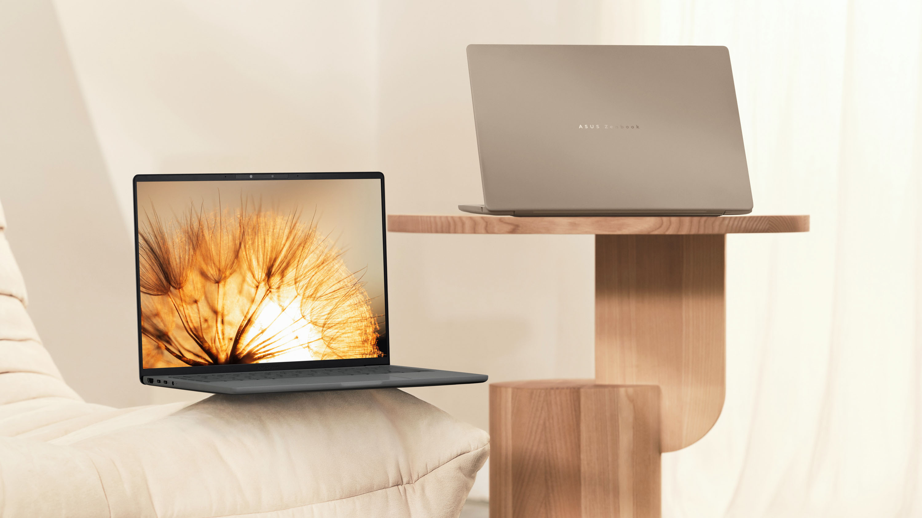 The ASUS Zenbook A14 (2025) in grey or beige.