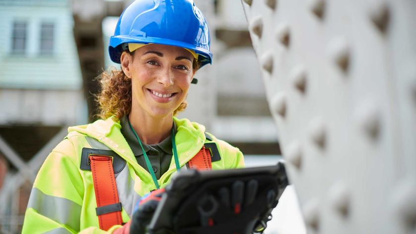 female structural engineer wearing blue hard hat