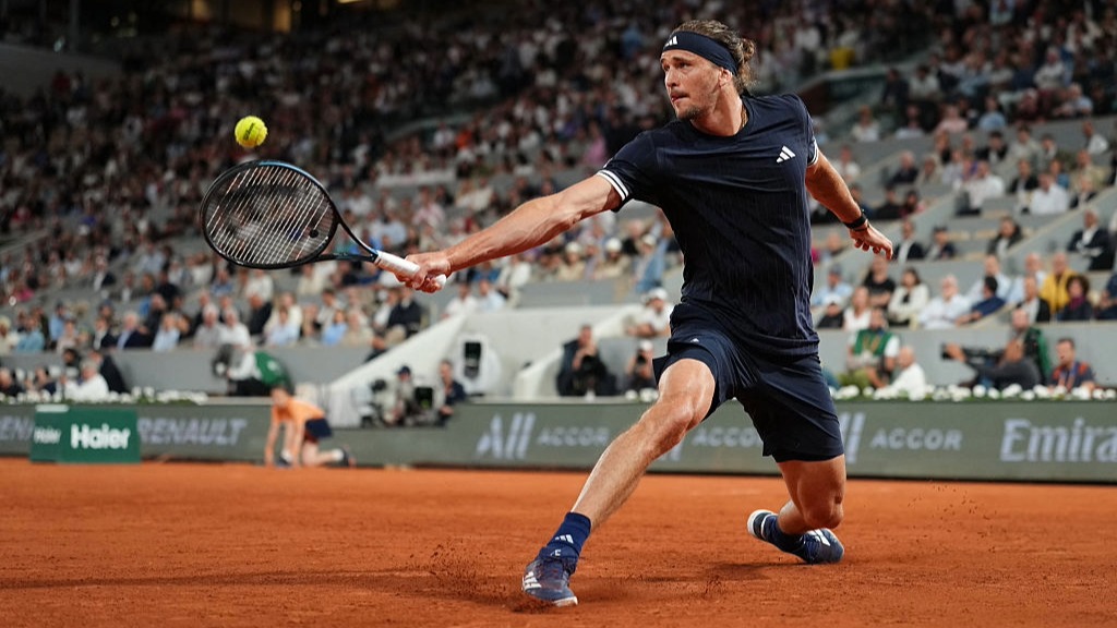 Alexander Zverev stretches to play a backhand at the French Open 2026.