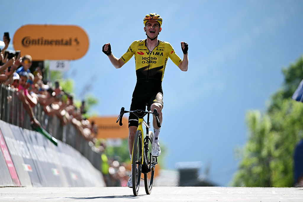 Sepp Kuss celebrates atop the final climb