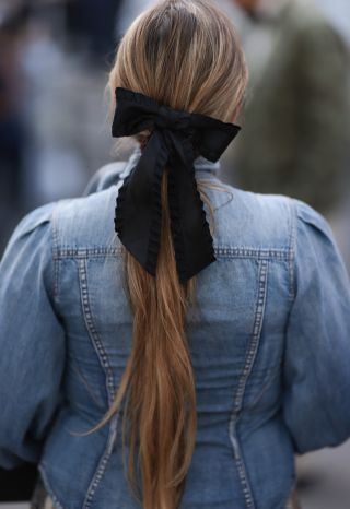 low ponytail with black ribbon