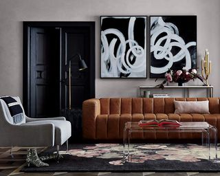A tan leather channeled sofa in a contemporary living room