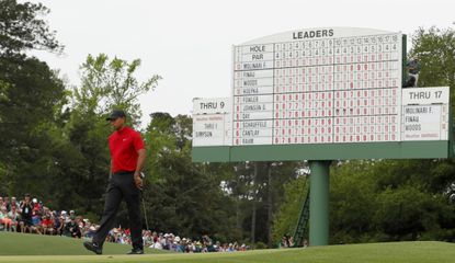 Woods in front of the leaderboard